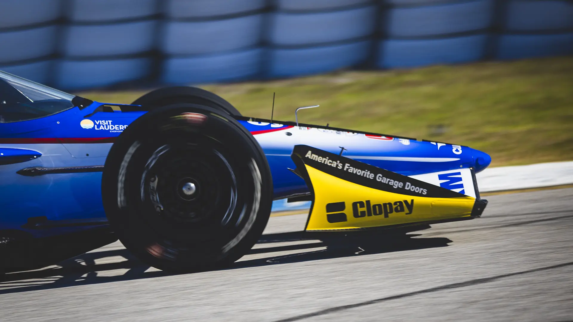 MSR Car with Clopay garage doors logo