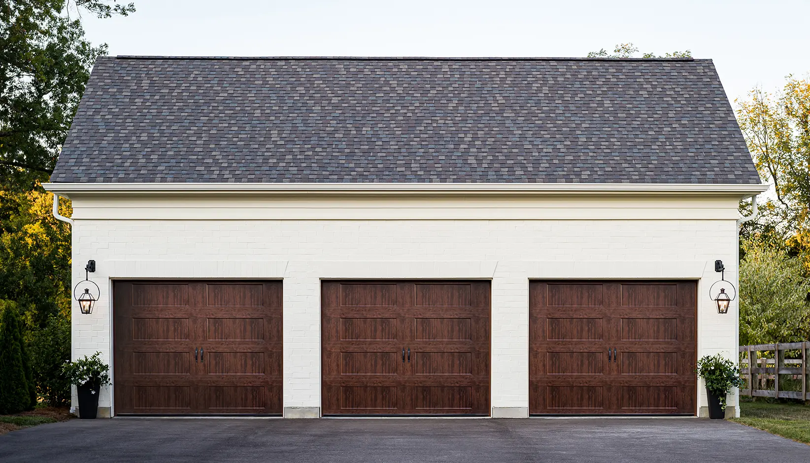 Bridgeport™ Steel garage door with extended recessed panels in Ultra-Grain® Walnut finish