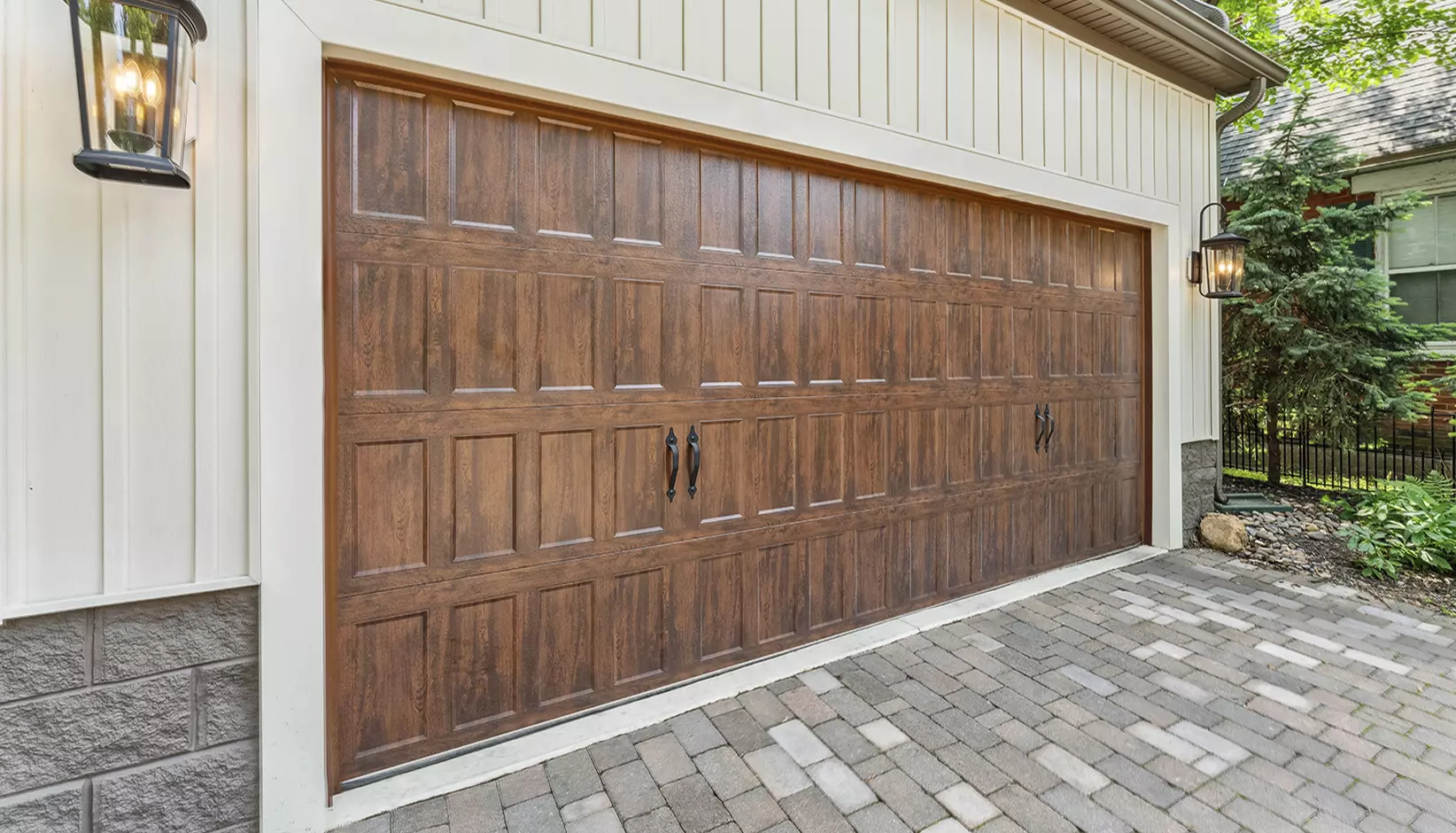 Bridgeport™ Steel garage door with narrow recessed panels in Ultra-Grain® Dark Finish