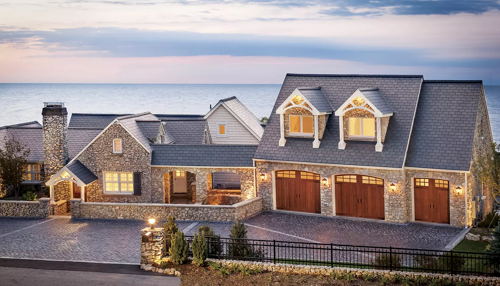 Canyon Ridge 5-Layer garage door Design 13 with ARCH3 windows in Dark finish