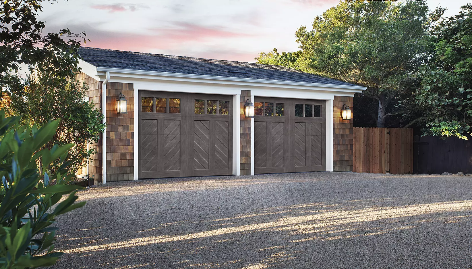 Canyon Ridge® Chevron garage door in Design 12, Option A with REC13 windows in Slate